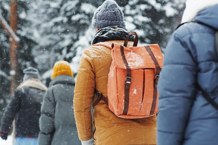 A group of outdoor hikers in the mountain as it snows. Multiracial Outdoor Enthusiasts, Outdoor Diversity, People Of Color In The Outdoors, Outdoor Adventurers Of Color