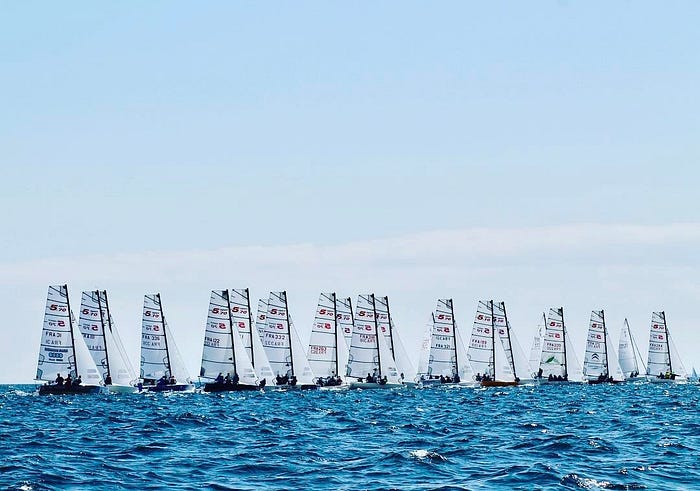 sailboats race on a sunny sea