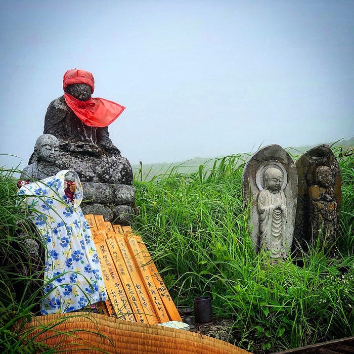 Jizo statues at the Busshoike pond next to the Ninth station of Mt. Gassan of the Dewa Sanzan