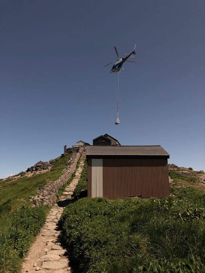 A helicopter carrying supplies to the top of Mt. Gassan of the Dewa Sanzan