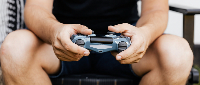 A man using a playstation controller.