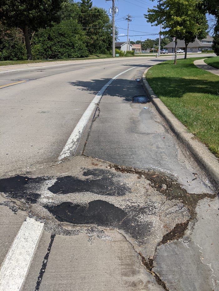 Giant pothole along bike path