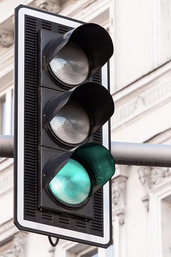 An image of a traffic signal with green light on