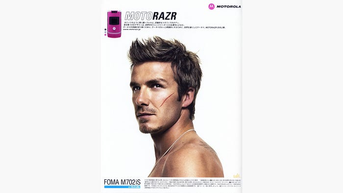 An original poster promoting Motorola RAZ and Rshowing David Beckham with a scar on his cheek.