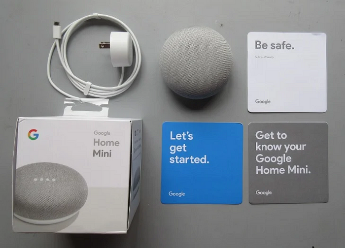 Google mini box and what’s inside. Three small cards with one sentence each describing simple steps to begin.
