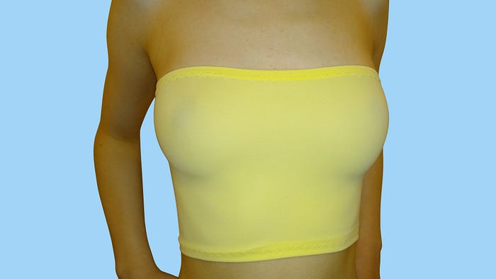 Yellow boob tube, worn braless