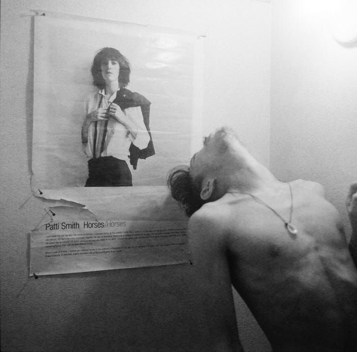 Robert Mapplethorpe in front of his cover for Patti Smith's Horses ...