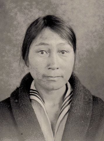 A black and white portrait of a woman