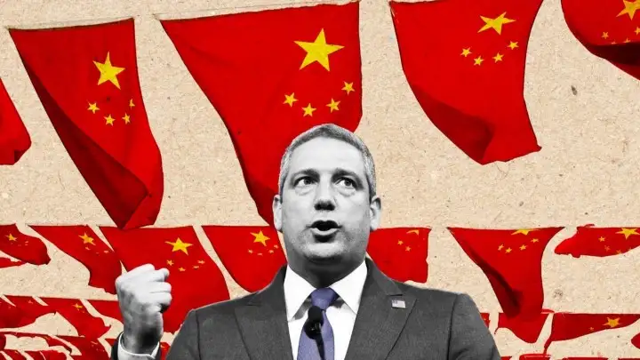 a picture of Tim Ryan in black and white against a backdrop of numerous Chinese flags. Courtesy Thomas Levinson/The Daily Beast/Getty