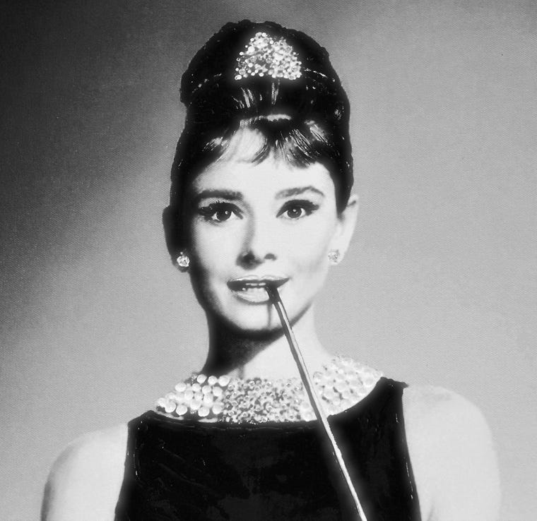 audrey hepburn black dress and pearls