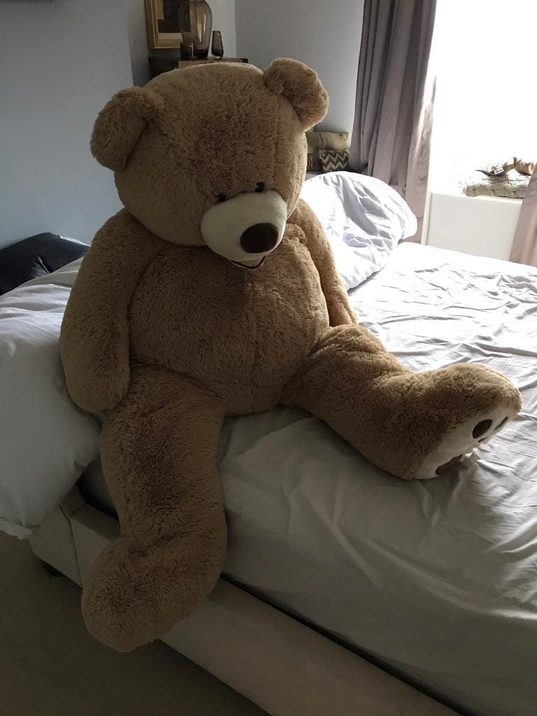 teddy bear on bed