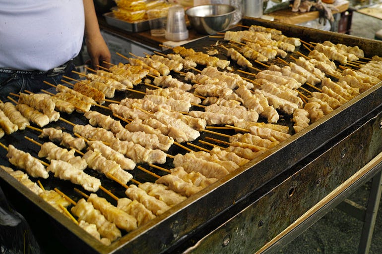 A grill covered with yakitori.