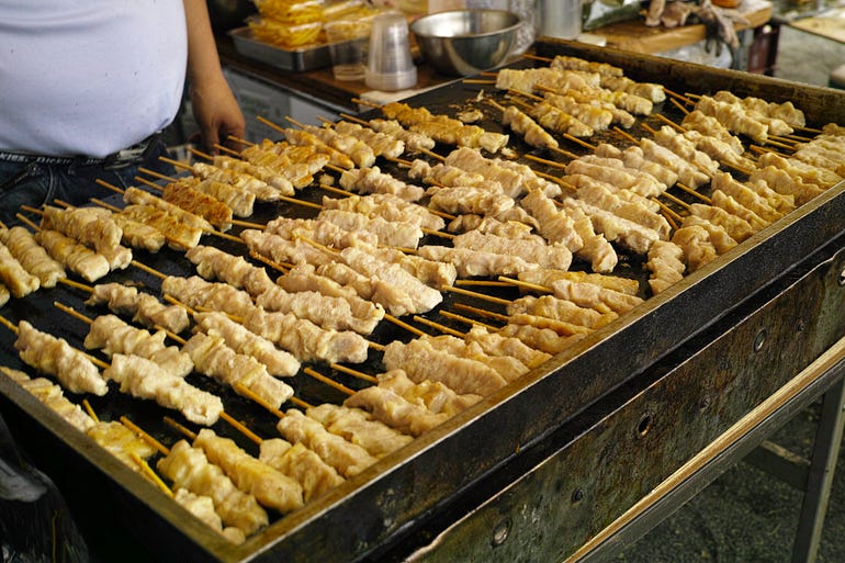 A grill covered with yakitori.