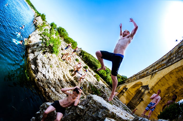  CiG participants swimming beneath the Roman Pont du Gard.