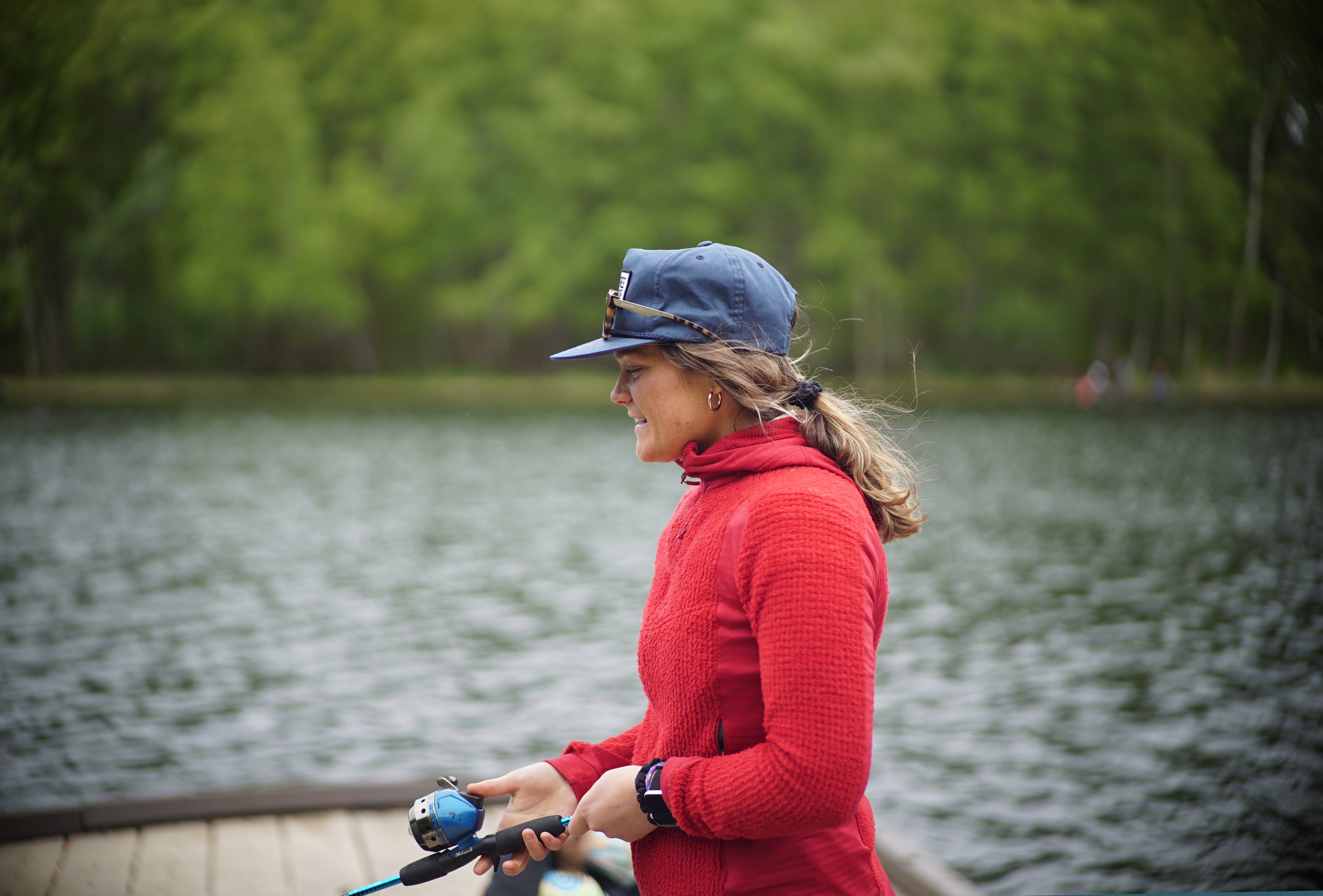 woman fishing on a dock