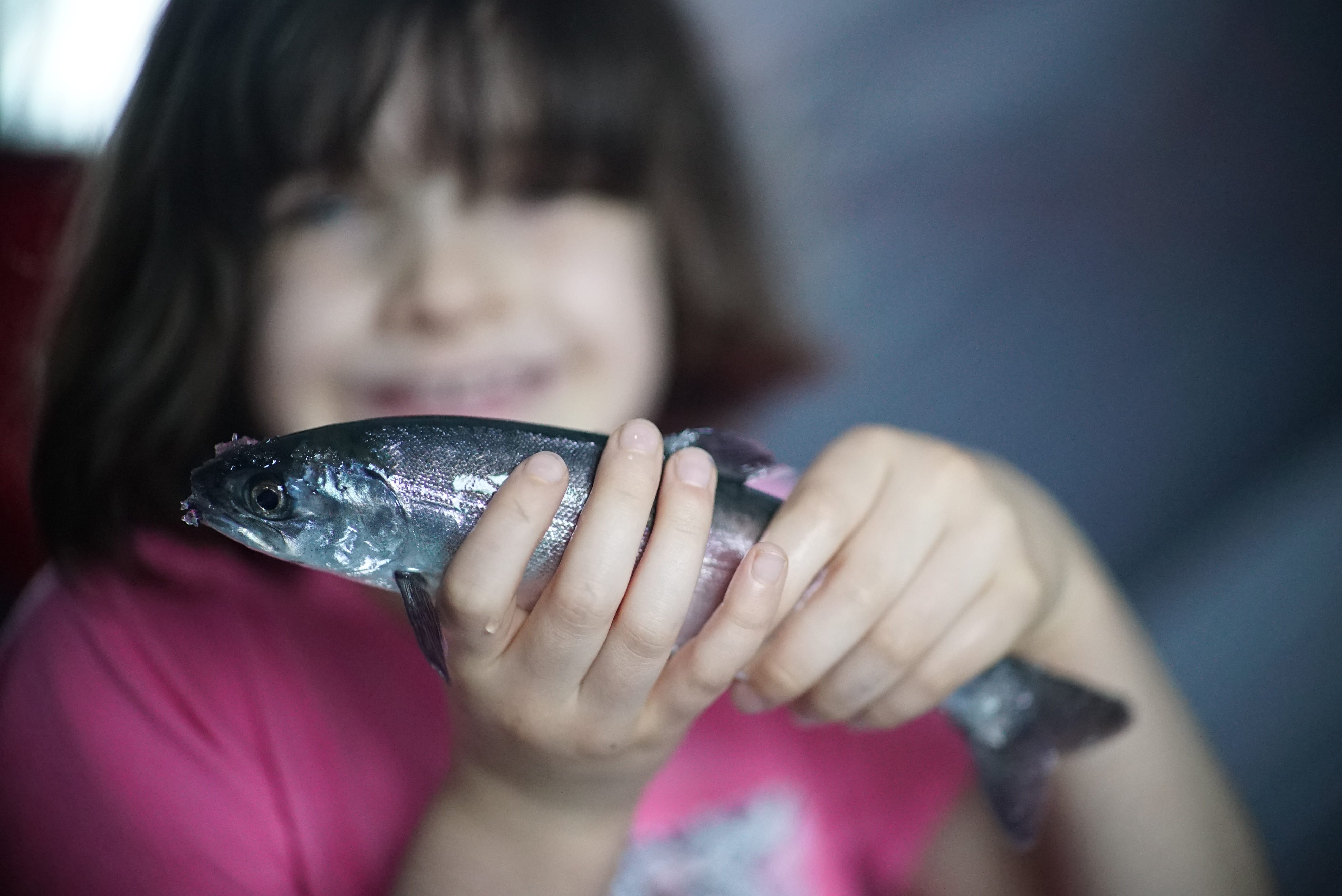 Girl holding a fish