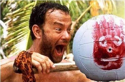Tom Hanks shouting at a Volleyball with a Bloody Handprint