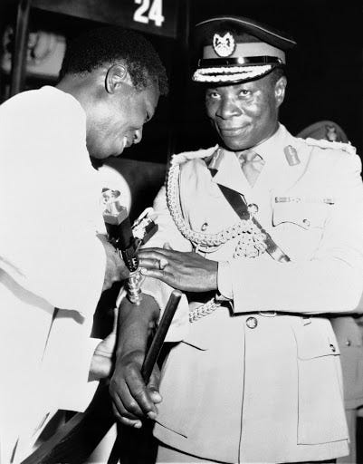 A Ghanan Official receiving a smallpox vaccination