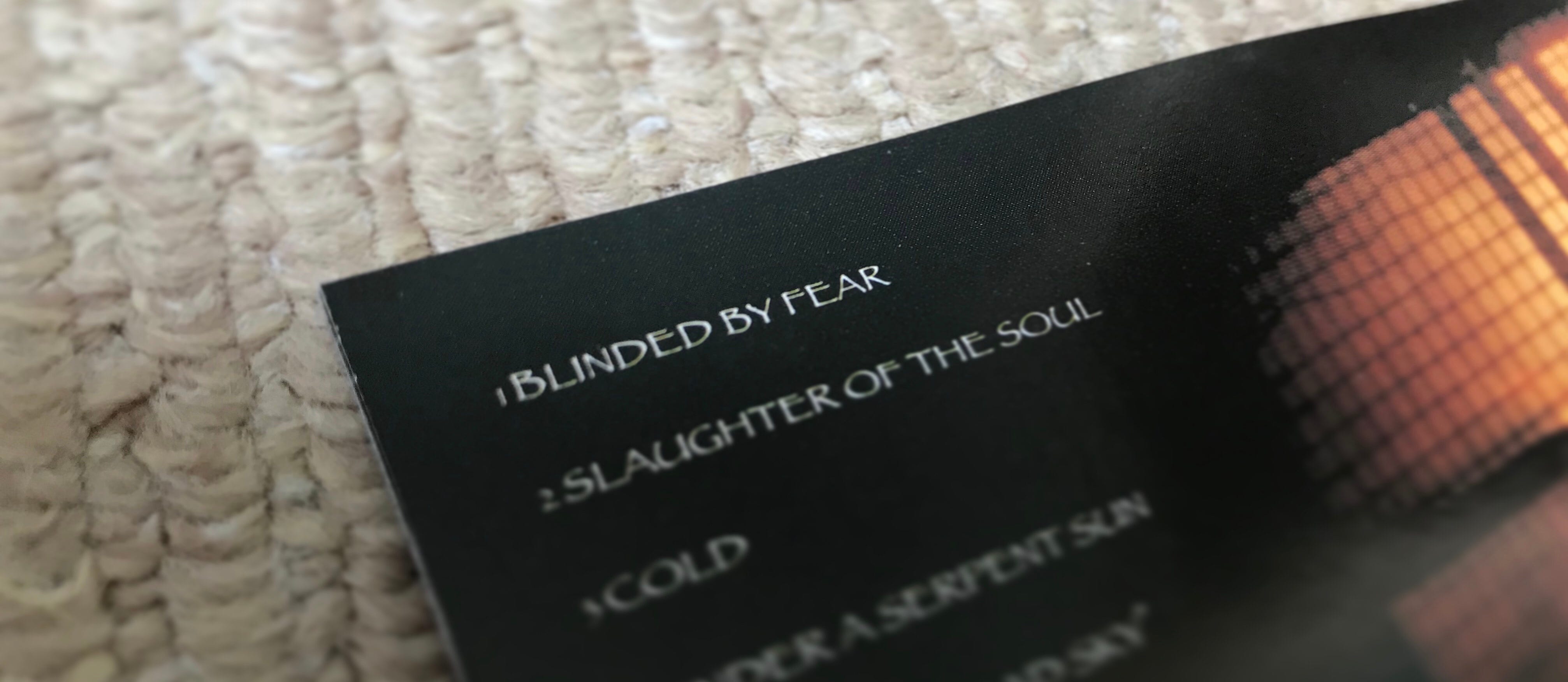 CD booklet featuring the song title ‘Blinded by Fear’