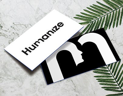 An artistic index card with humanize, and some leaves