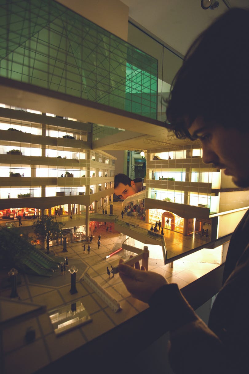 a model of a large building lit up with lights