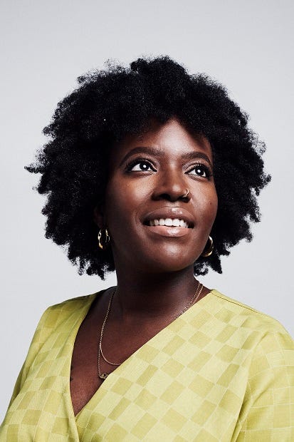 An image of Seyi Akiwowo, founder and Director at Glitch and author of this article. She’s wearing a yelow top and gold earrings. She’s looking up and to the right side, and is smiling.