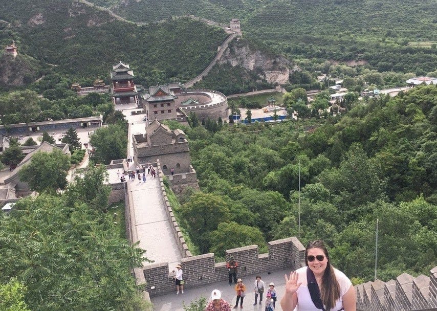 Dr. Vanderloo posing with great wall of China.