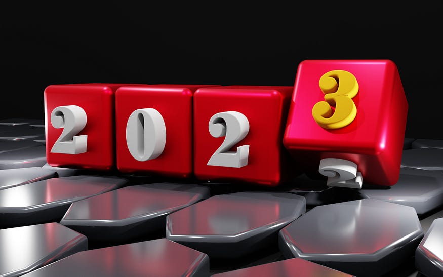 Four red blocks with numbers that make 2–0–2–3 year