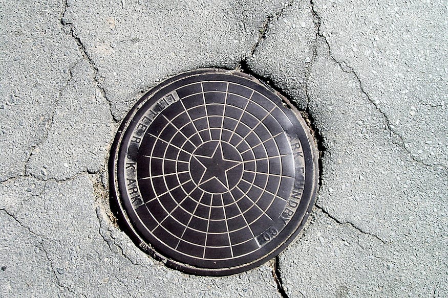 Littlerock, AR Manhole cover, i.e. a Street Coin