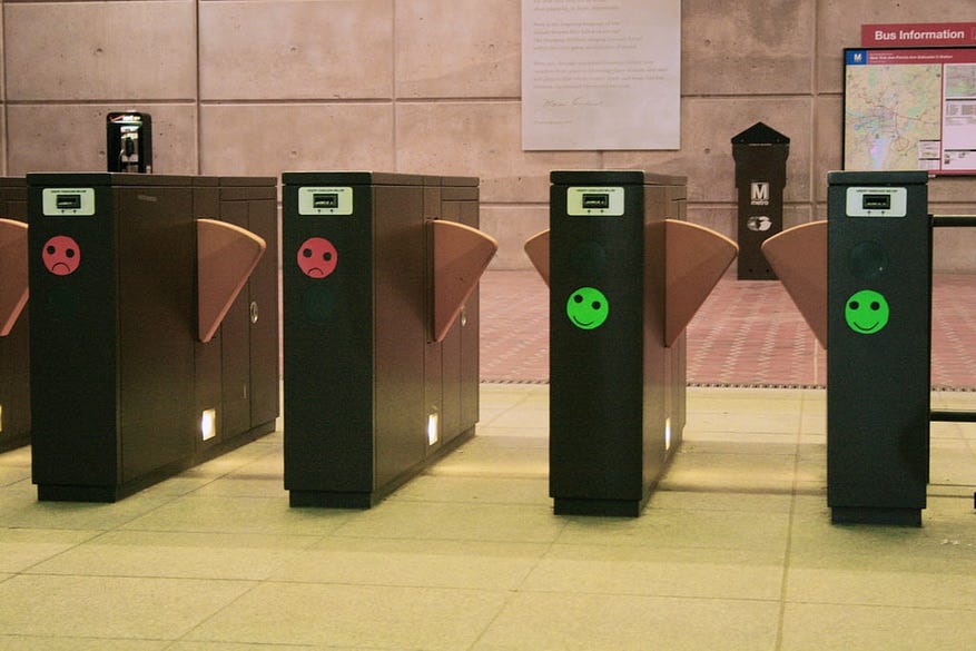 Ticket booths with smiley faces in subway