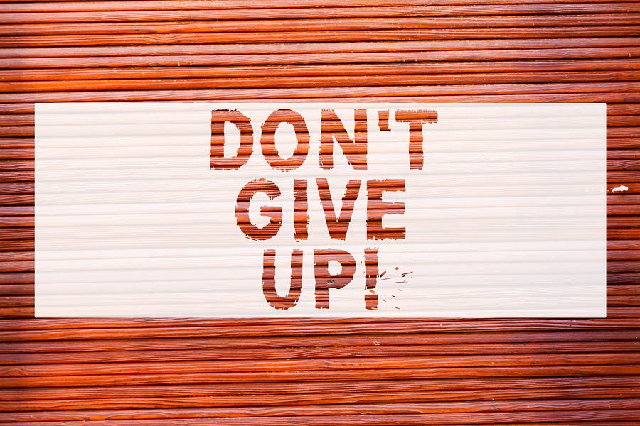 don't give up sign on white background