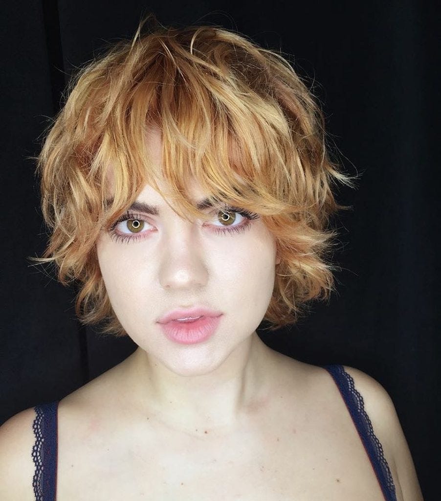 Strawberry Blonde Shag With Undone Textured Waves And Bangs