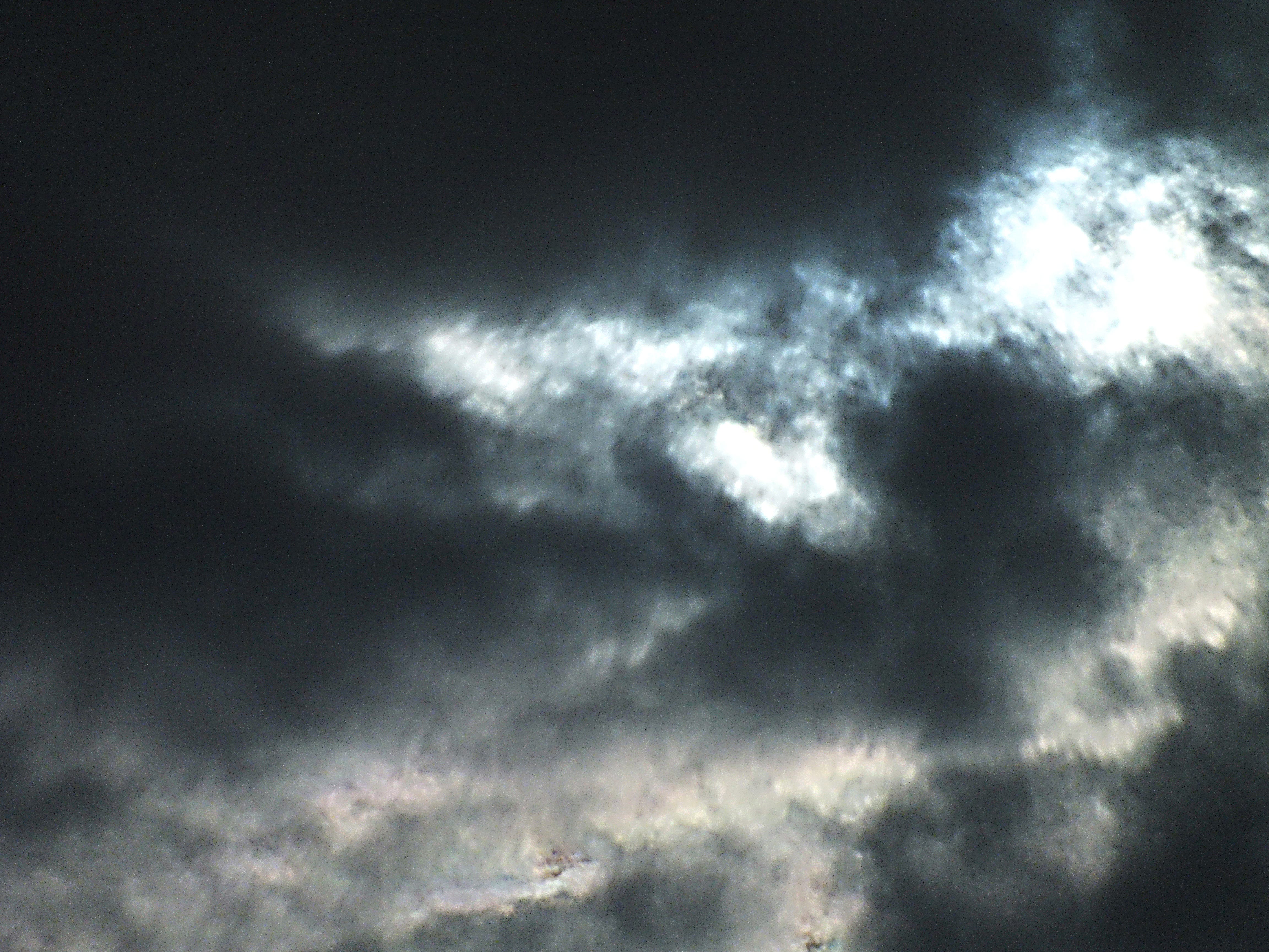 An angry sky fill of dark clouds and smoke.