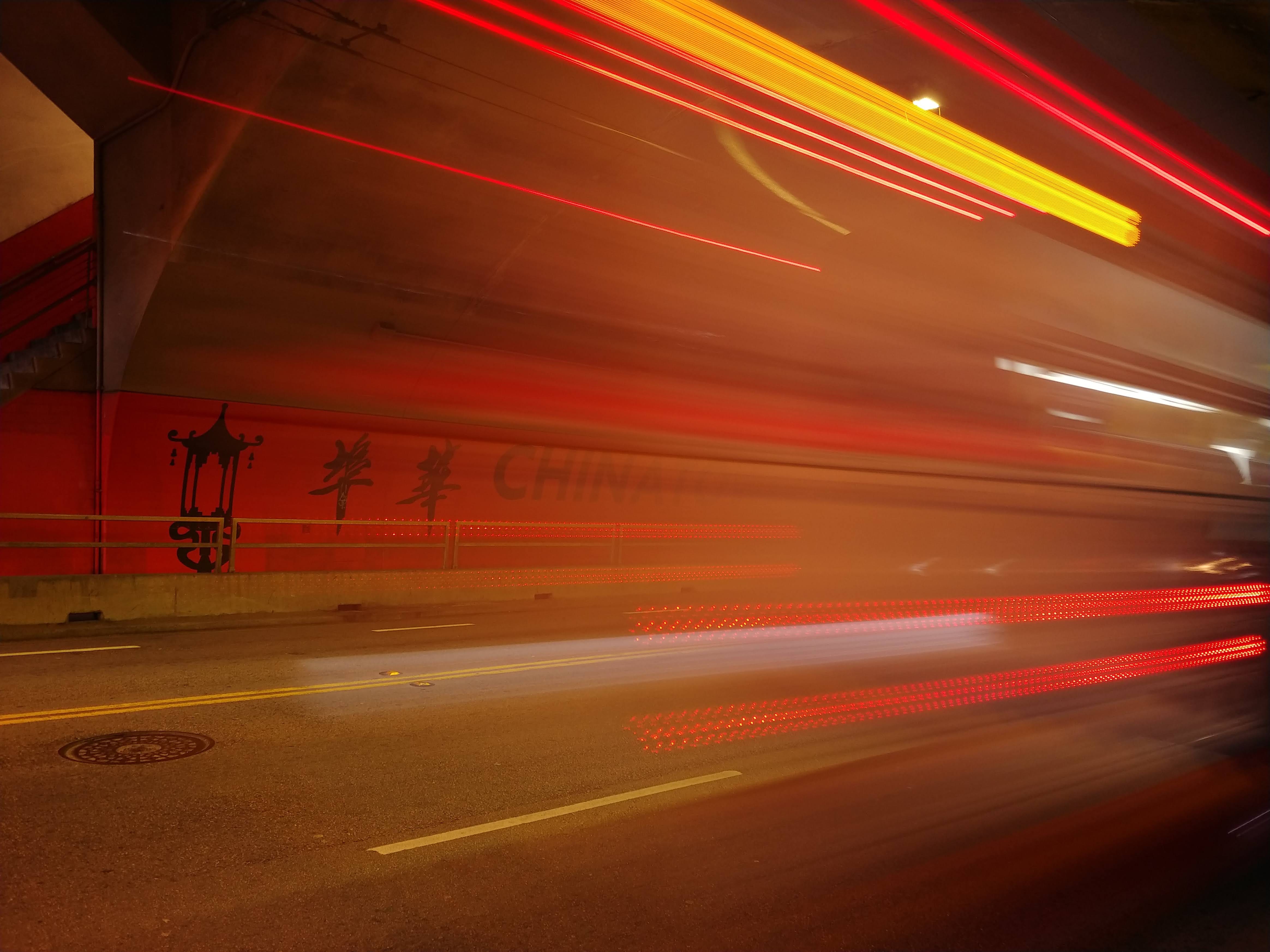 A long exposure shot of a moving vehicle inside a subway.