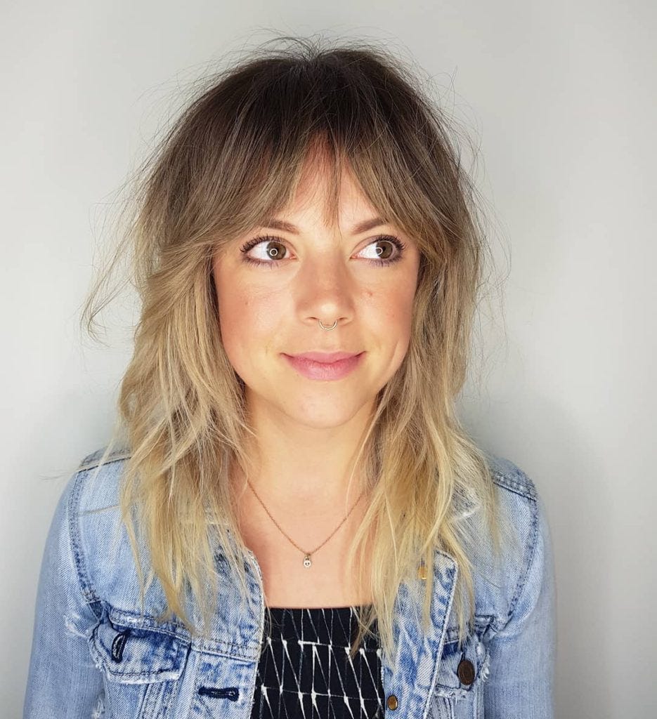 Blonde Sun Kissed Shag With Curtain Bangs And Undone Wavy Texture
