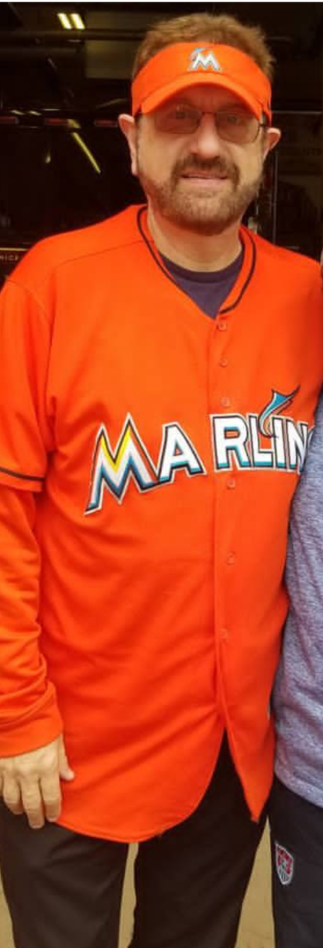 guy in orange marlins jersey
