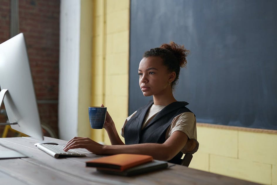 A woman working in front of a computer
