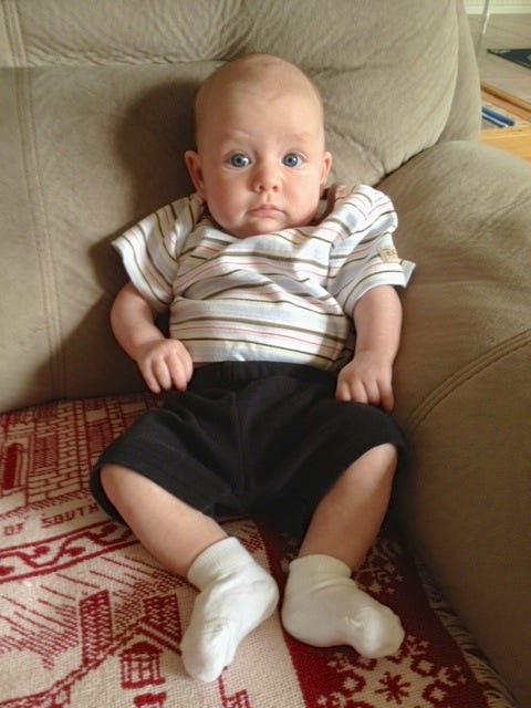 boy dressed as baby girl