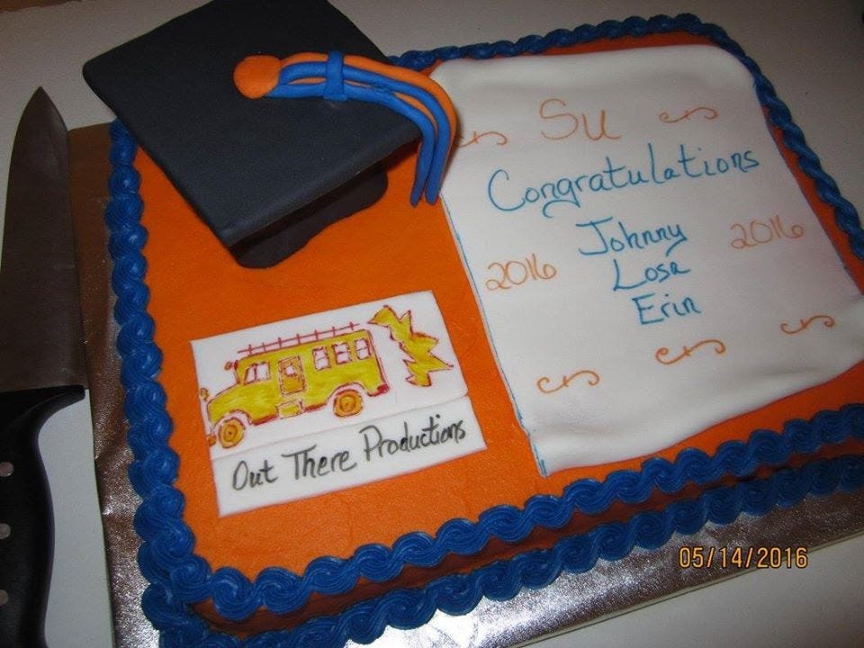 Cake with out there productions logo on it