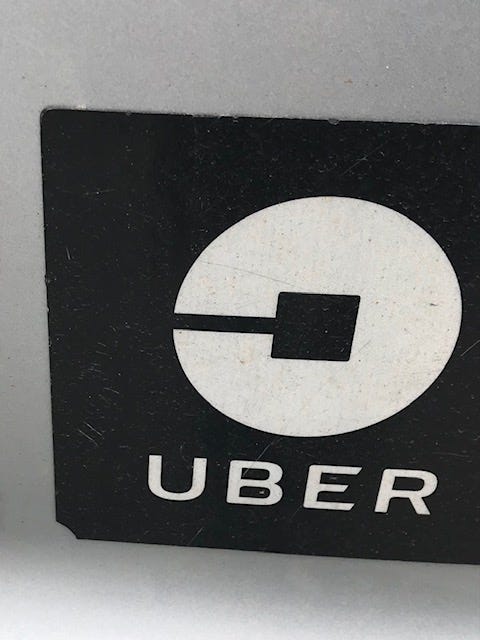 Photo of Uber sticker on car.
