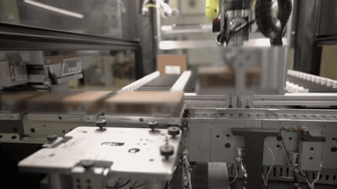 Robotic grabber picking up device.