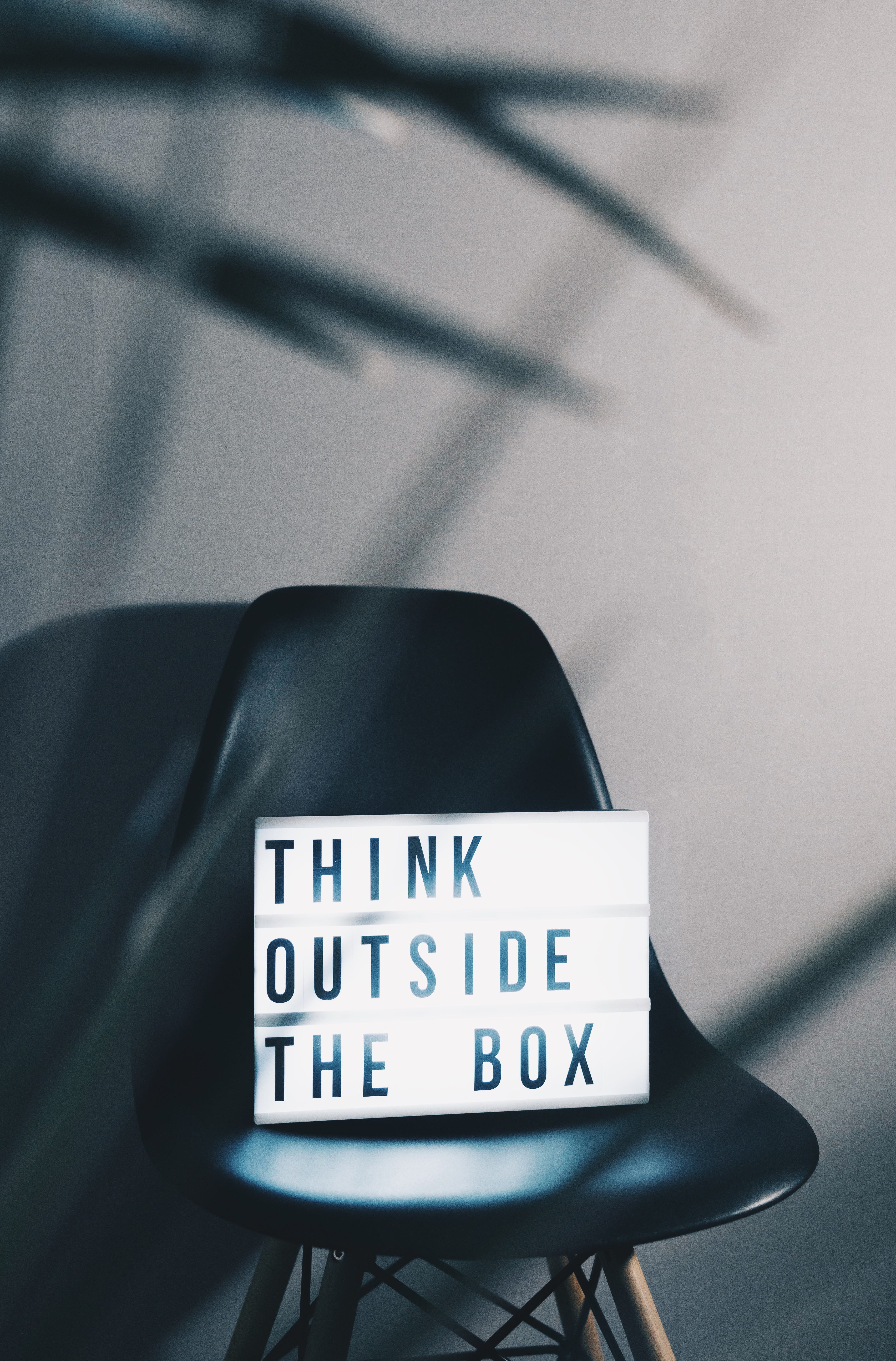 A sign that reads “Think outside the box.”