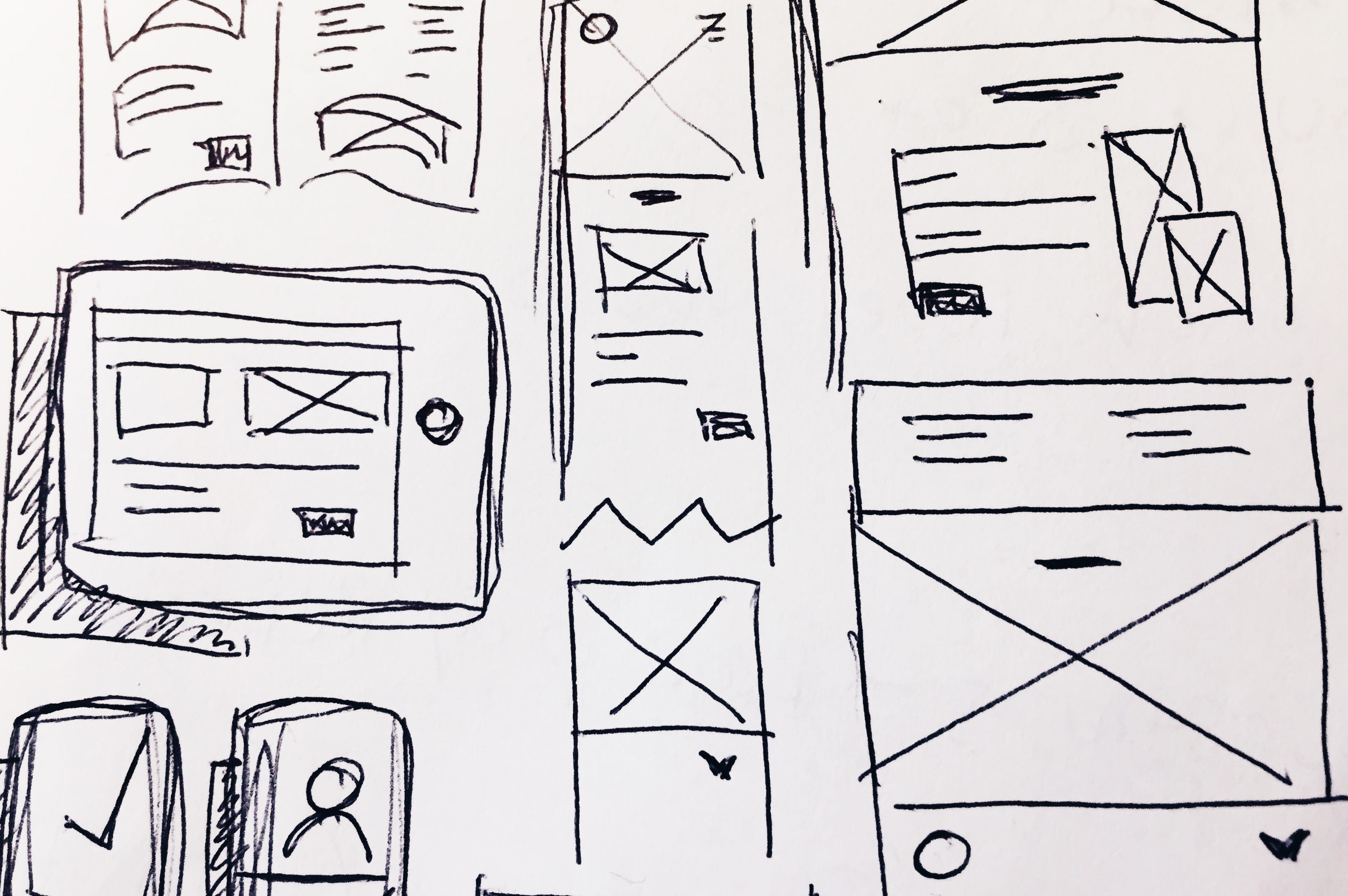 sketches of wireframes on paper