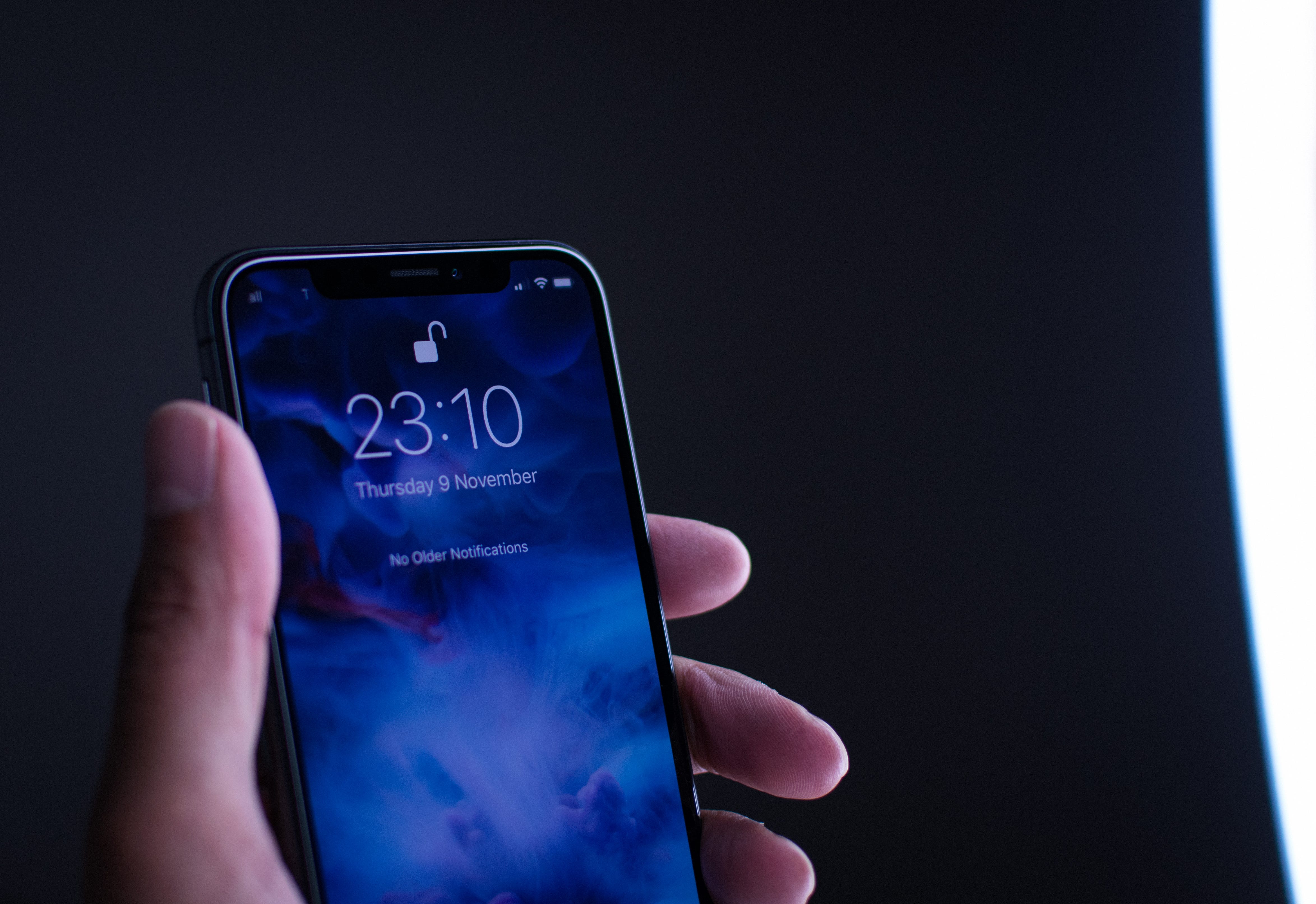 An iPhone being unlocked using Face Unlock