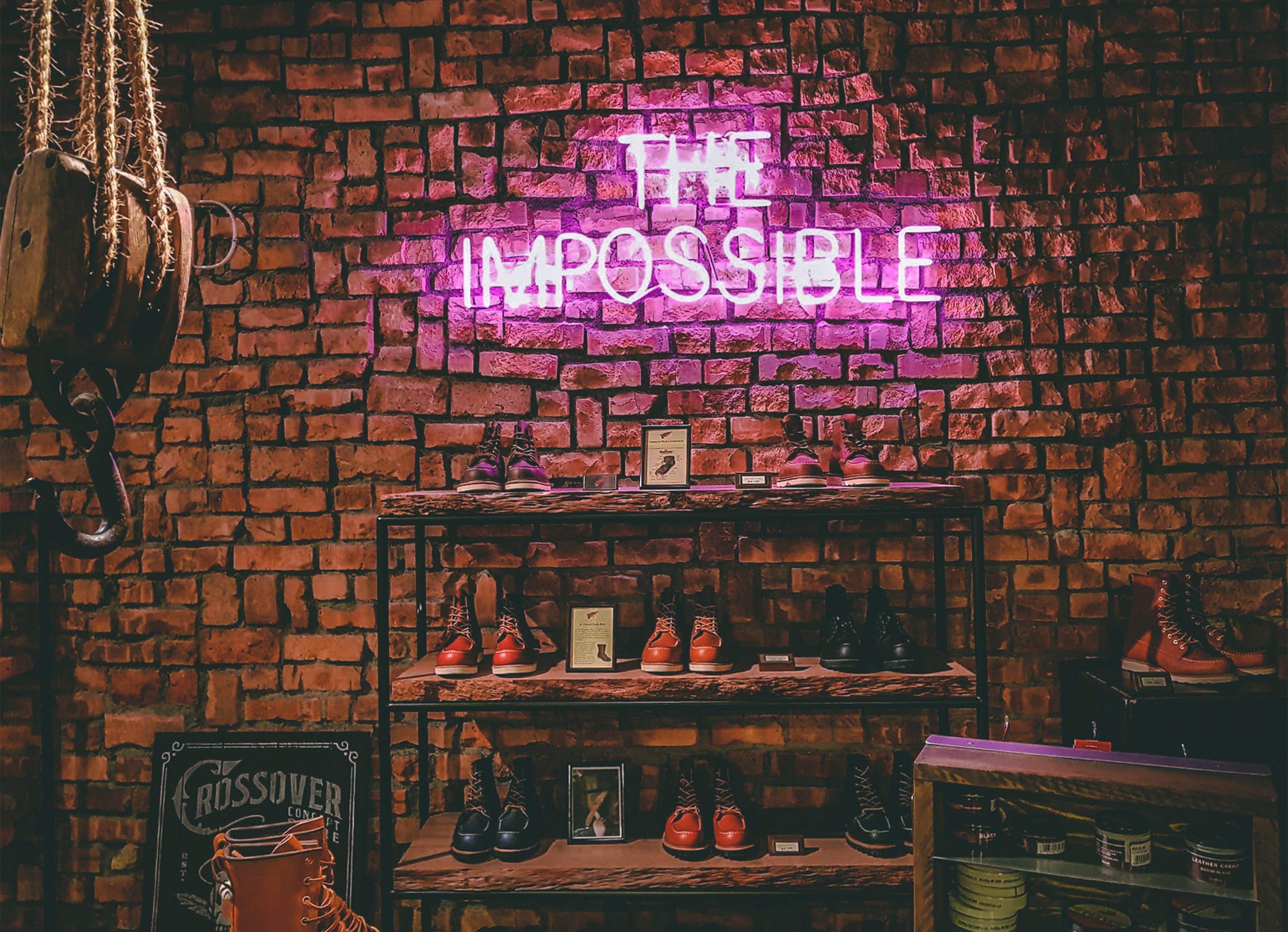 A neon light sign that says The Impossible
