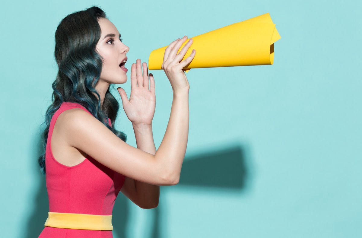 Woman speaking through a megaphone