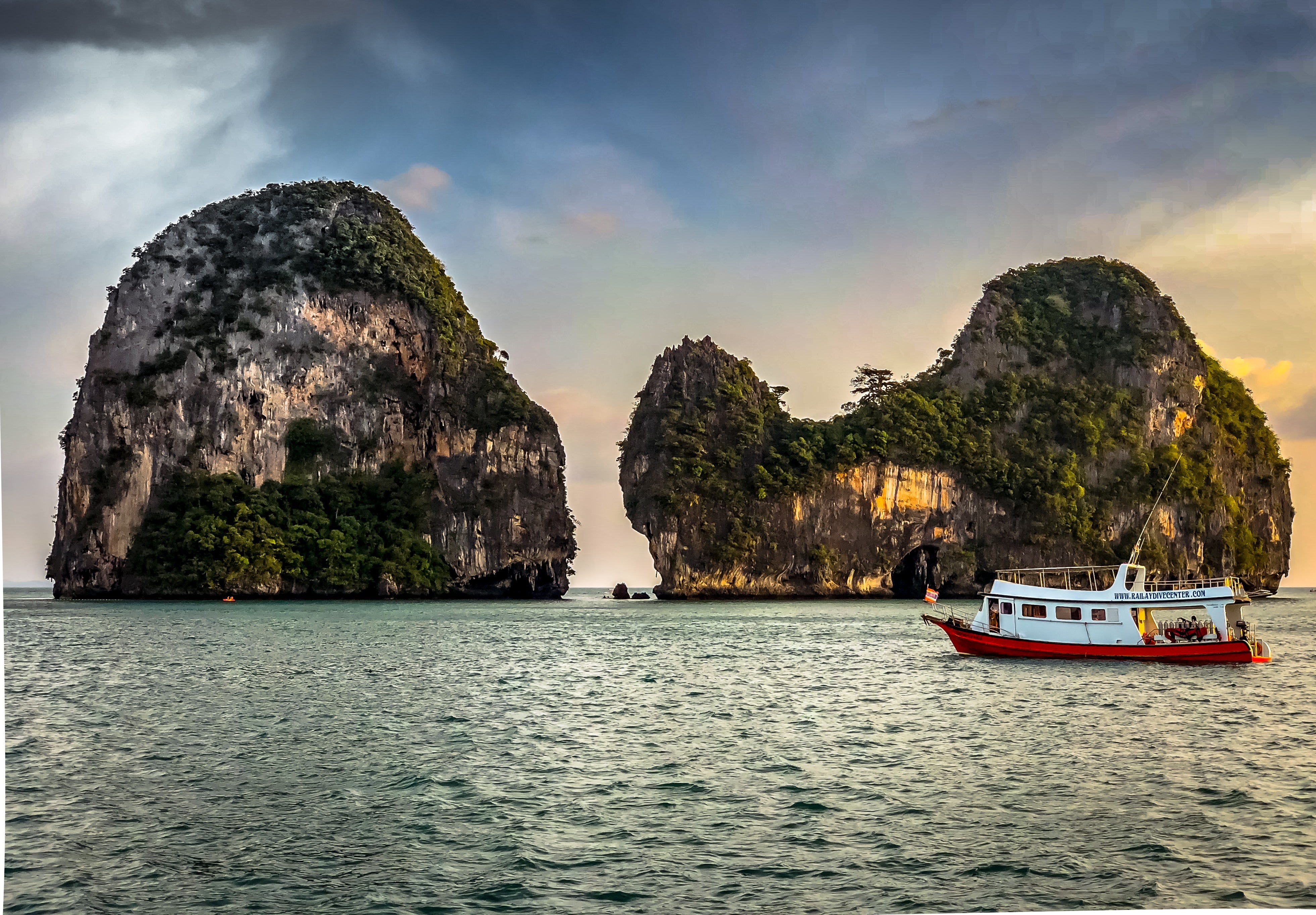 photo of two rock islands connected underwater