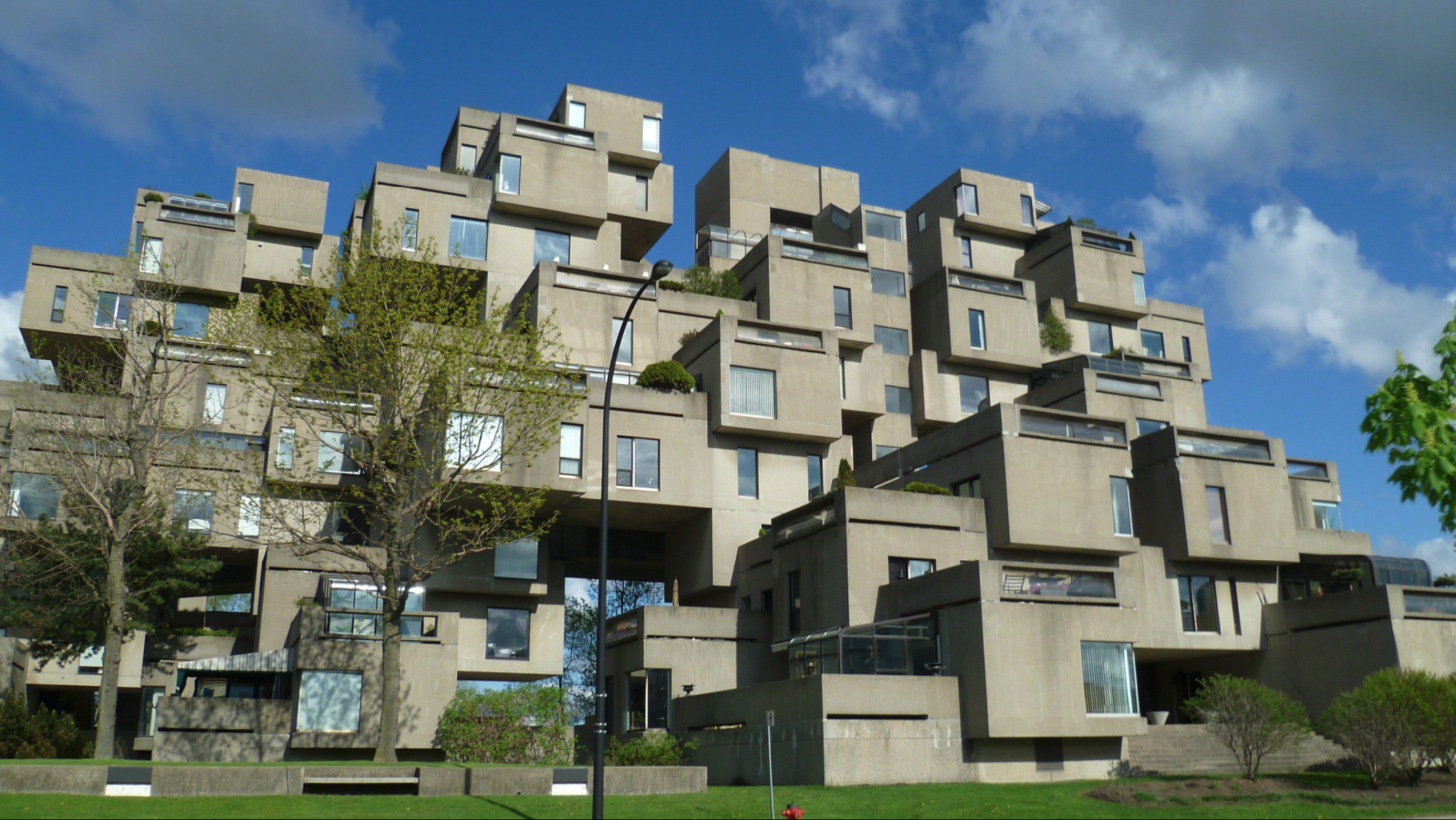 A concrete building made of many overlapping cubes.