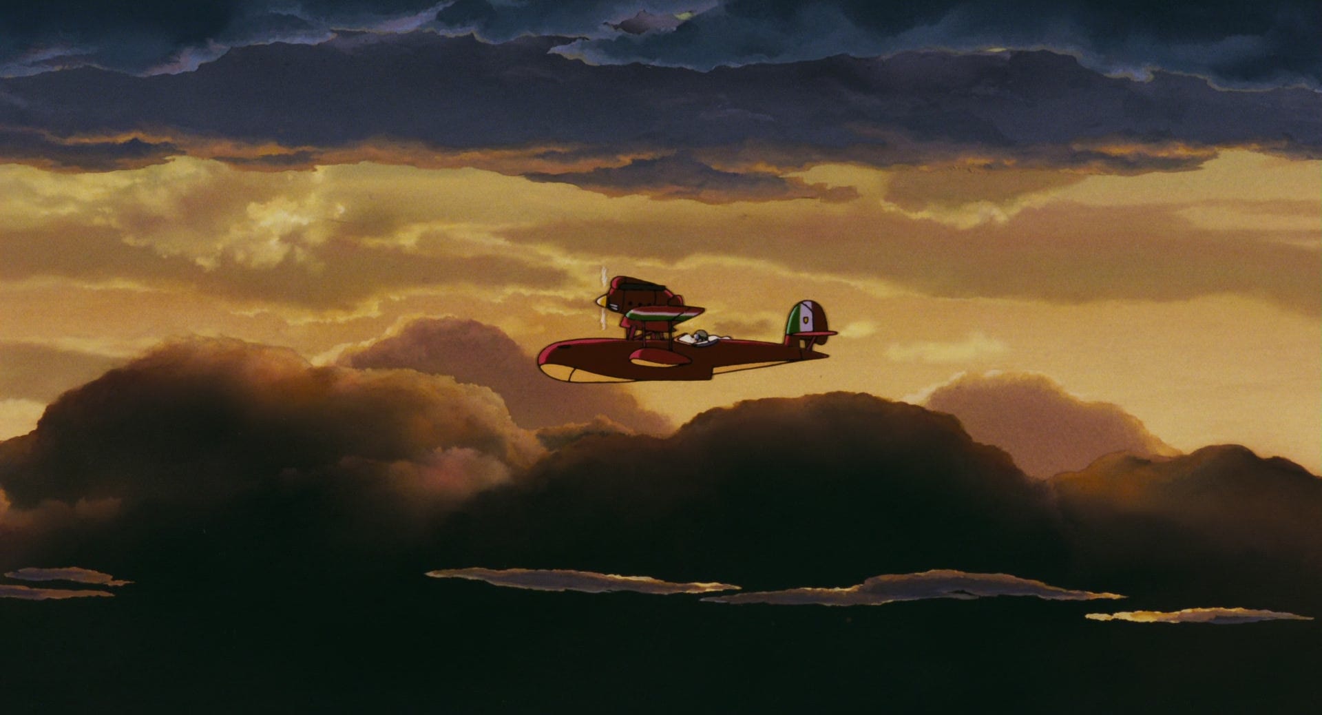 Porco flying on his plane at sunset.