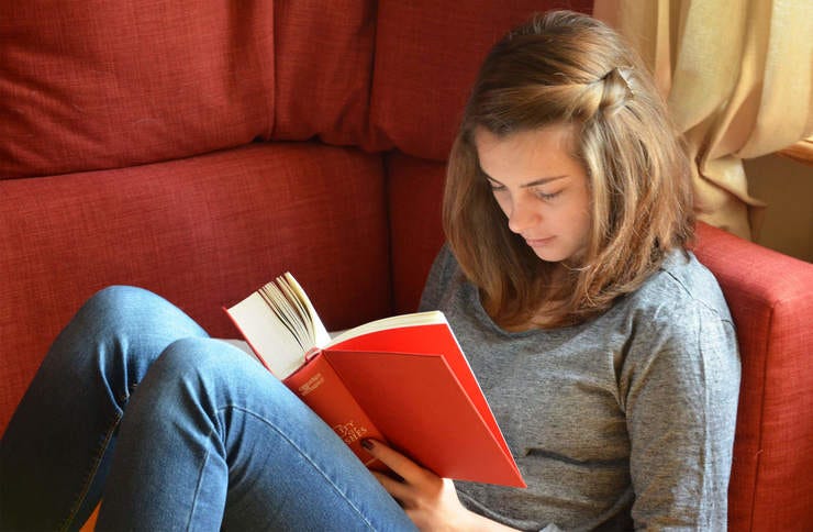 Young woman reading a book
